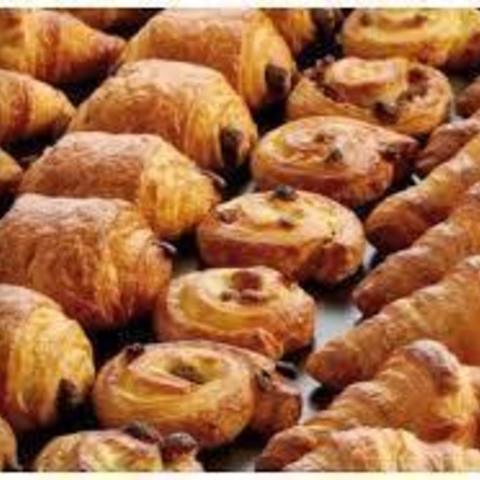 Caterer on booth  Tray of mini pastries