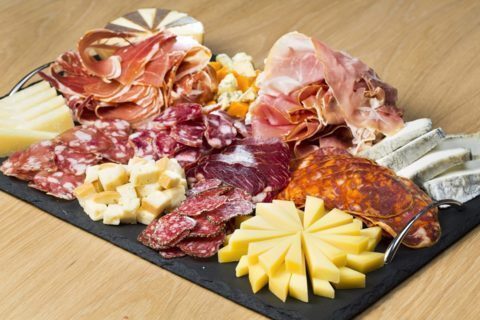 Caterer on booth Mixed Charcuterie and Cheese Board