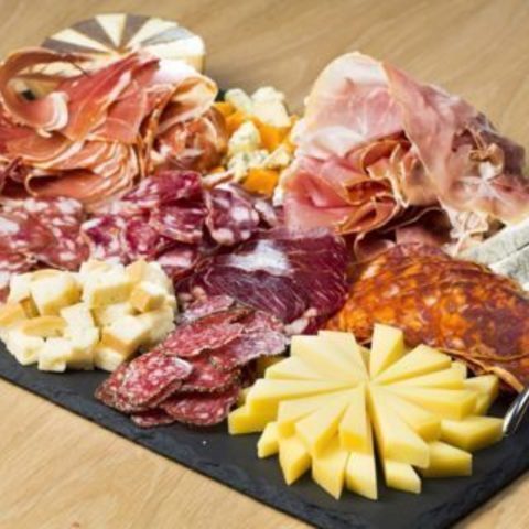 Caterer on booth Mixed Charcuterie and Cheese Board