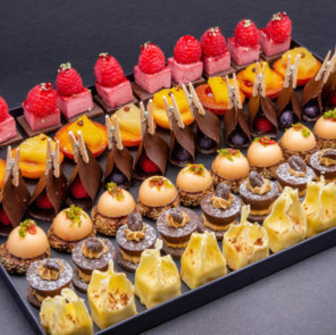 Caterer on booth Platter of Mignardises